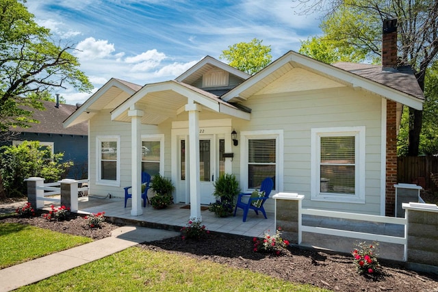 2222 N University, Little Rock, AR 72207 - bungalow with covered porch and a chimney
