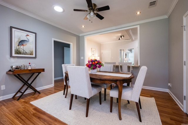2222 N University, Little Rock, AR 72207 - dining area featuring wood finished floors, ornamental molding, a ceiling fan, and recessed lighting