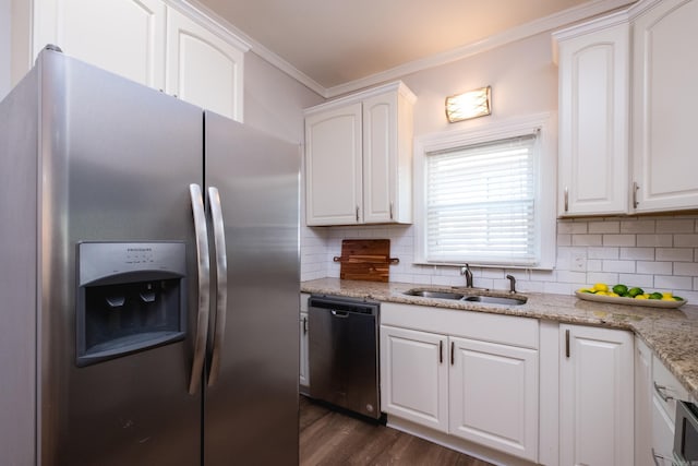 2222 N University, Little Rock, AR 72207 - kitchen featuring stainless steel appliances, tasteful backsplash, crown molding, white cabinets, and light stone counters