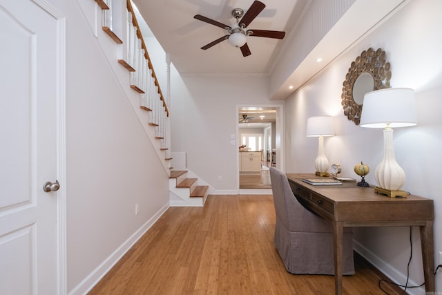 2222 N University, Little Rock, AR 72207 - entrance foyer featuring a ceiling fan, light wood-style floors, stairway, and crown molding