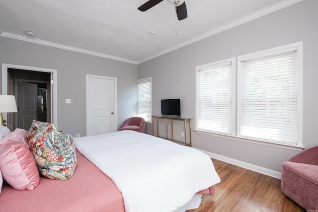 2222 N University, Little Rock, AR 72207 - bedroom with ornamental molding, wood finished floors, and a ceiling fan