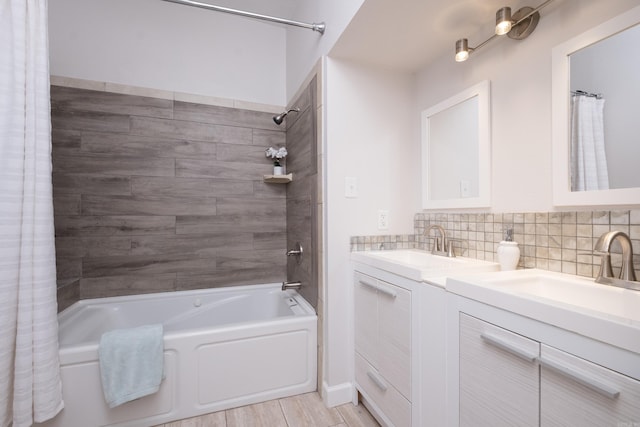 2222 N University, Little Rock, AR 72207 - bathroom with double vanity, shower / bath combo, decorative backsplash, and wood finished floors