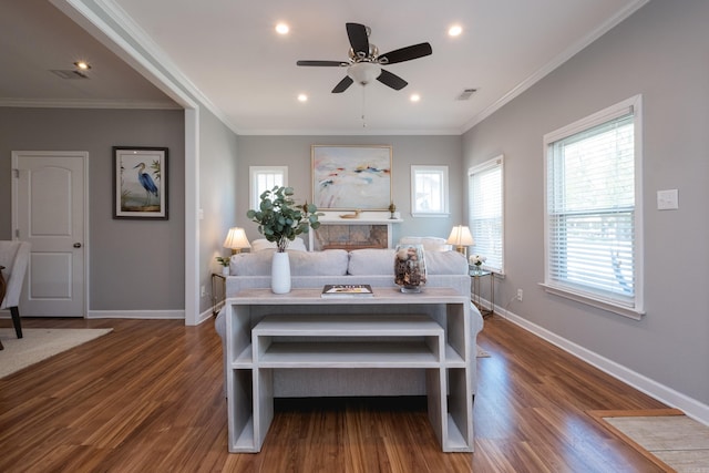 2222 N University, Little Rock, AR 72207 - living area featuring a ceiling fan, dark wood-type flooring, crown molding, and recessed lighting