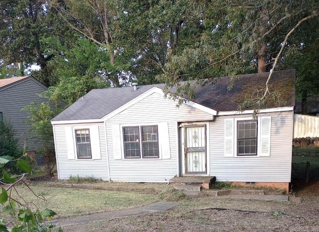 view of front facade with crawl space and roof with shingles