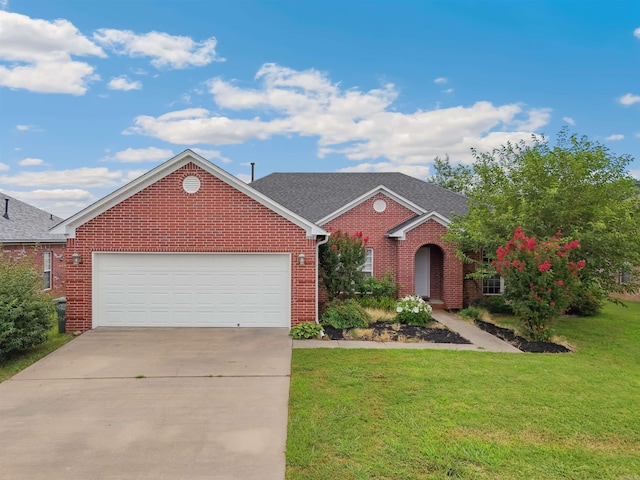 1700 Hosta, Conway, AR 72034 - traditional home with brick siding, concrete driveway, a front lawn, a garage, and roof with shingles
