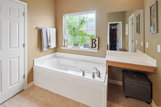 1700 Hosta, Conway, AR 72034 - bathroom featuring tile patterned floors, a whirlpool tub, and vanity