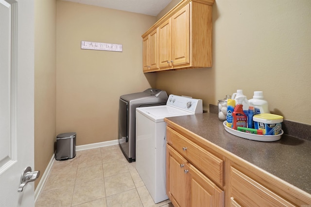 1700 Hosta, Conway, AR 72034 - washroom featuring independent washer and dryer, cabinet space, and light tile patterned floors