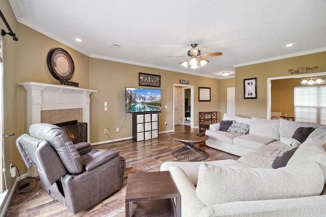 1700 Hosta, Conway, AR 72034 - living area featuring a ceiling fan, ornamental molding, a lit fireplace, wood finished floors, and recessed lighting