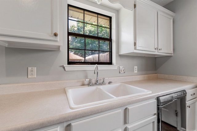 1465 Pyramid Dr, Conway, AR 72034 - kitchen with dishwasher, white cabinetry, and light countertops