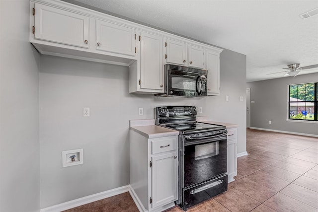 1465 Pyramid Dr, Conway, AR 72034 - kitchen featuring black appliances, light countertops, white cabinets, light tile patterned floors, and a textured ceiling