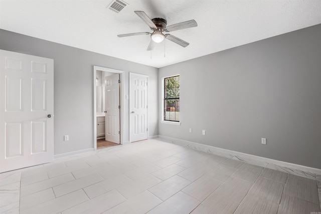 1465 Pyramid Dr, Conway, AR 72034 - unfurnished bedroom with connected bathroom and ceiling fan