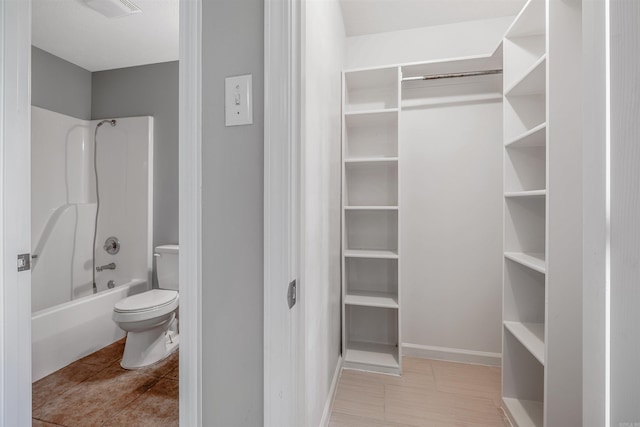 1465 Pyramid Dr, Conway, AR 72034 - bathroom with  shower combination, a walk in closet, and tile patterned flooring