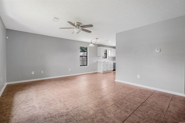 1465 Pyramid Dr, Conway, AR 72034 - unfurnished living room with a ceiling fan and light tile patterned floors