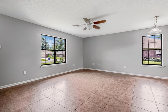 1465 Pyramid Dr, Conway, AR 72034 - empty room with ceiling fan, light tile patterned flooring, and a textured ceiling