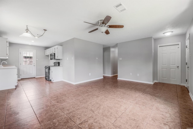 1465 Pyramid Dr, Conway, AR 72034 - unfurnished living room with ceiling fan and light tile patterned floors