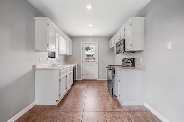 1465 Pyramid Dr, Conway, AR 72034 - kitchen with black appliances, white cabinets, light countertops, and recessed lighting