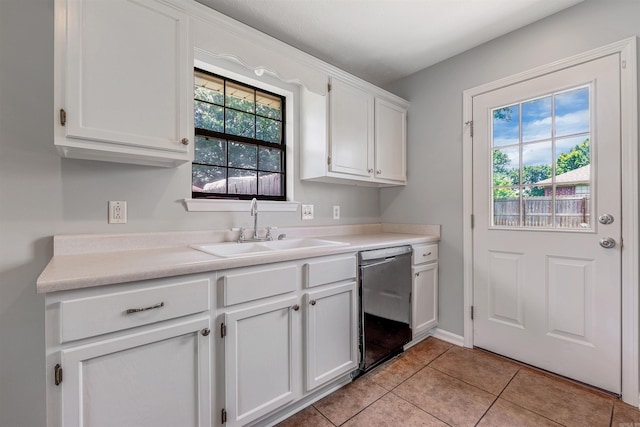 1465 Pyramid Dr, Conway, AR 72034 - kitchen featuring dishwasher, white cabinets, light tile patterned floors, and light countertops