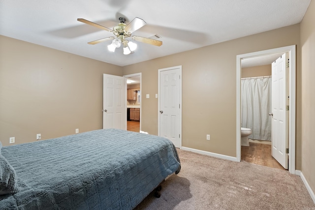 1410 Pyramid Dr, Conway, AR 72032 - carpeted bedroom featuring connected bathroom and ceiling fan