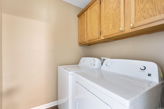 1410 Pyramid Dr, Conway, AR 72032 - laundry area featuring cabinet space and independent washer and dryer