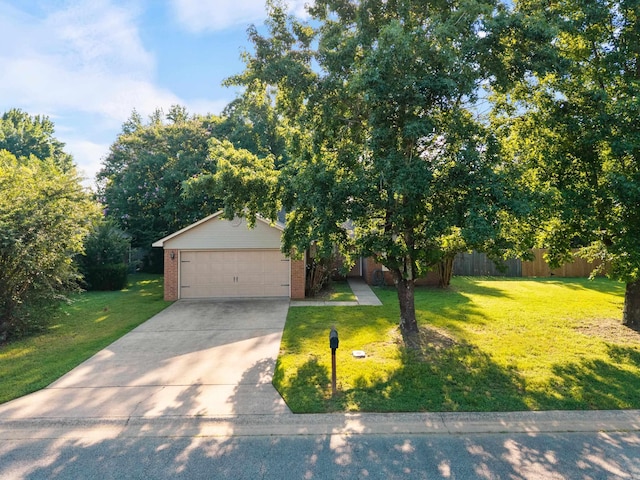 1410 Pyramid Dr, Conway, AR 72032 - view of front of home featuring a front yard, driveway, and brick siding
