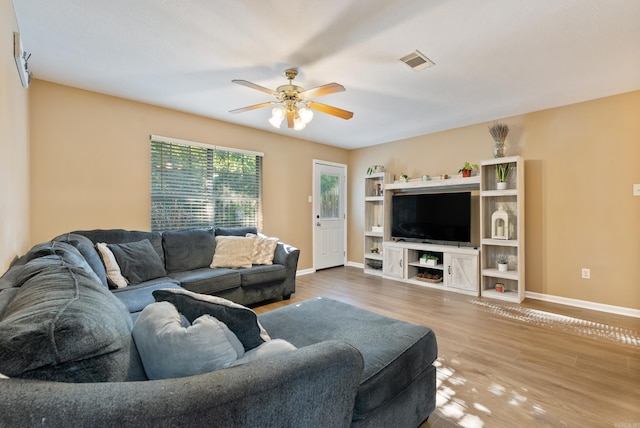 1410 Pyramid Dr, Conway, AR 72032 - living area with a ceiling fan and wood finished floors