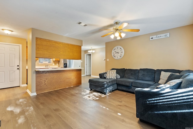 1410 Pyramid Dr, Conway, AR 72032 - living room featuring a ceiling fan and light wood finished floors