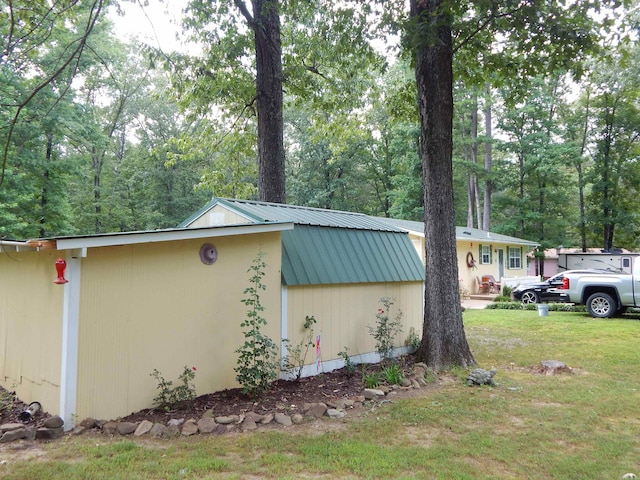 155 N Ridge Rd, Heber Springs, AR 72543 - view of side of home featuring a metal roof and a yard