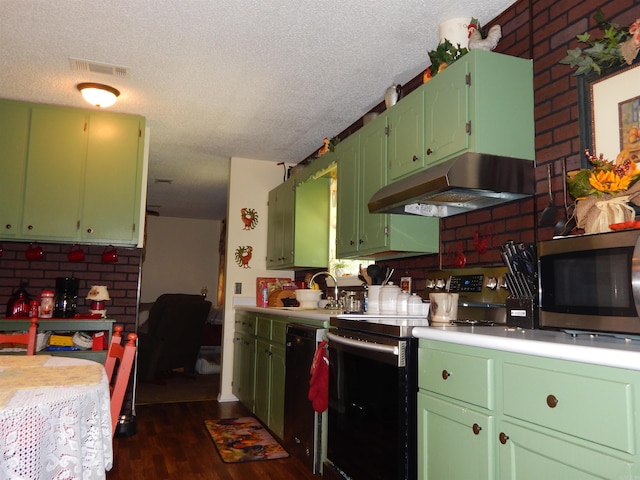 155 N Ridge Rd, Heber Springs, AR 72543 - kitchen with appliances with stainless steel finishes, under cabinet range hood, light countertops, dark wood-type flooring, and a textured ceiling