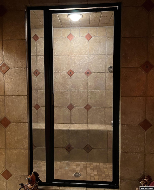 bathroom featuring an enclosed shower