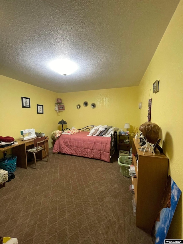 carpeted bedroom featuring a textured ceiling