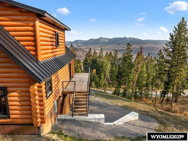 view of side of home featuring a mountain view