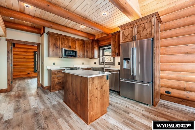 kitchen featuring wood ceiling, light hardwood / wood-style flooring, stainless steel appliances, a center island, and beamed ceiling