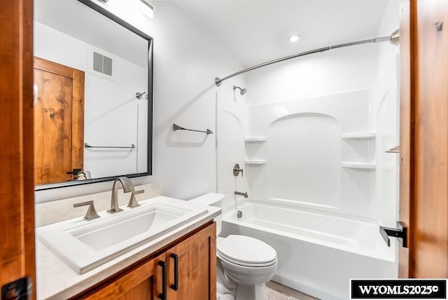 full bathroom with bathtub / shower combination, vanity, and toilet