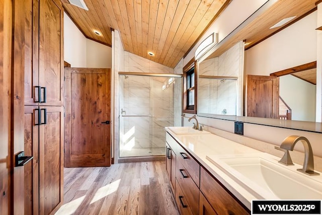 bathroom featuring an enclosed shower, wood-type flooring, vaulted ceiling, wooden ceiling, and vanity