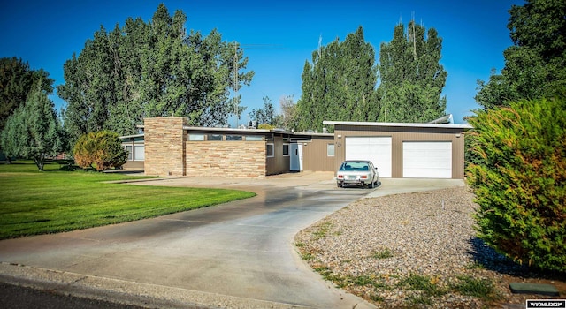 single story home featuring a front lawn, a garage, and a carport