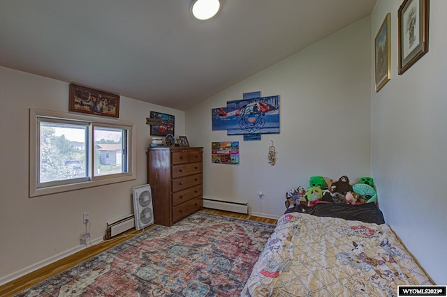 bedroom featuring dark hardwood / wood-style flooring, lofted ceiling, and a baseboard heating unit