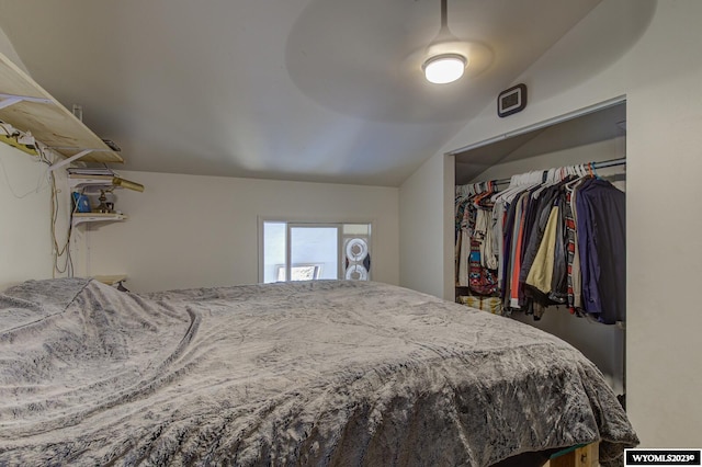 bedroom featuring a closet and lofted ceiling