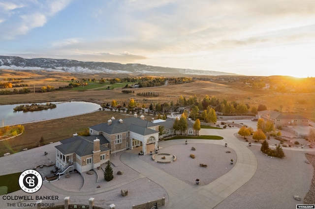 birds eye view of property with a mountain view