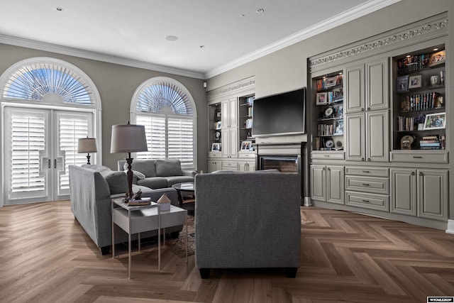 living room with ornamental molding, dark parquet flooring, and a fireplace