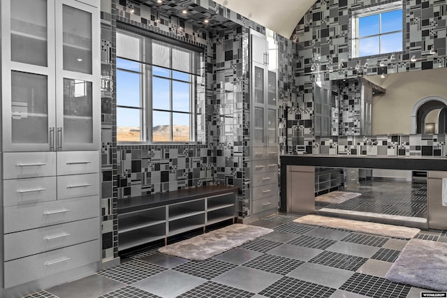 bathroom featuring vaulted ceiling