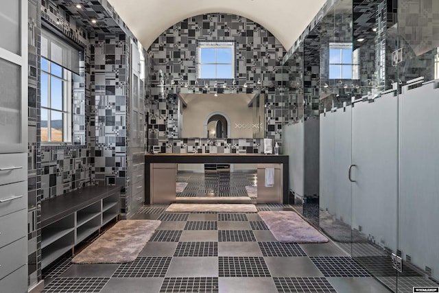 bathroom with lofted ceiling