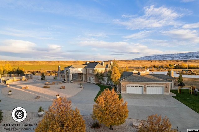 view of front of home featuring a garage and a mountain view