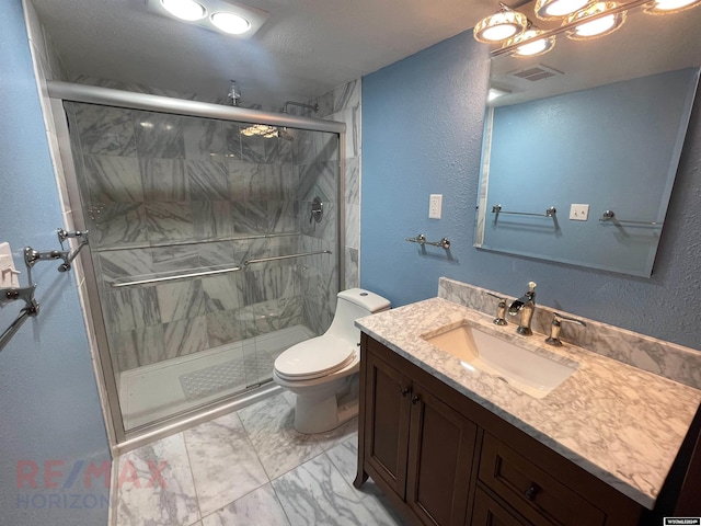 bathroom with visible vents, toilet, marble finish floor, vanity, and a shower stall