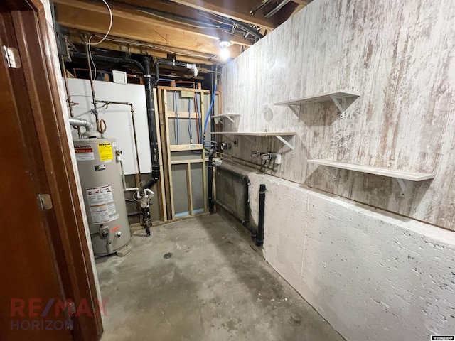 unfinished basement featuring water heater