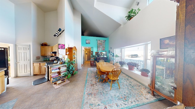 tiled dining space with high vaulted ceiling