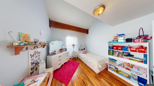 bedroom with hardwood / wood-style flooring and vaulted ceiling