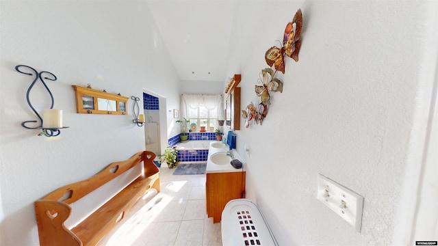 hall featuring light tile patterned floors