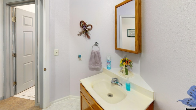 bathroom with vanity and tile patterned floors