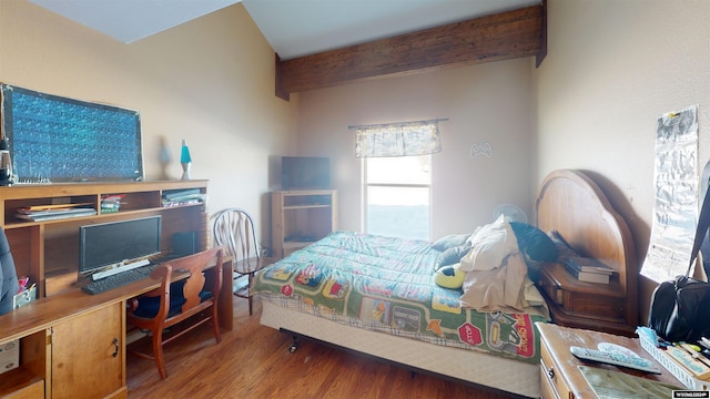 bedroom featuring beam ceiling and hardwood / wood-style flooring