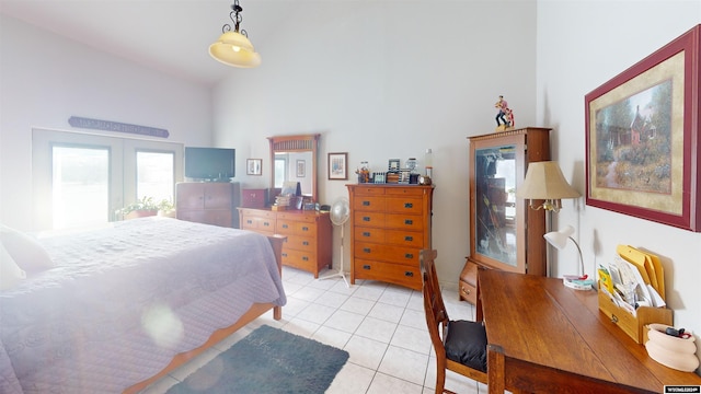 tiled bedroom with a high ceiling